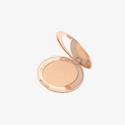 Charlotte Tilbury | היילייטר פודרה להארה (גוון Champagne) "Hollywood Glow Glide Highlighter"